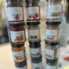 Mini jars of tapenade, jam, mustard in a gift tube