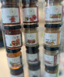 Mini jars of tapenade, jam, mustard in a gift tube
